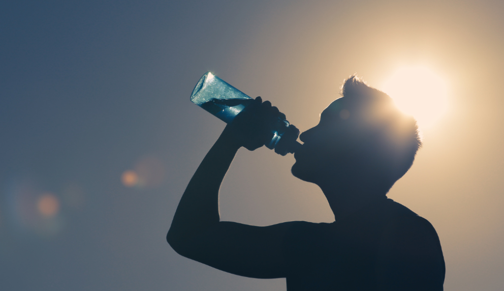 Athlete drinking water and staying hydrated