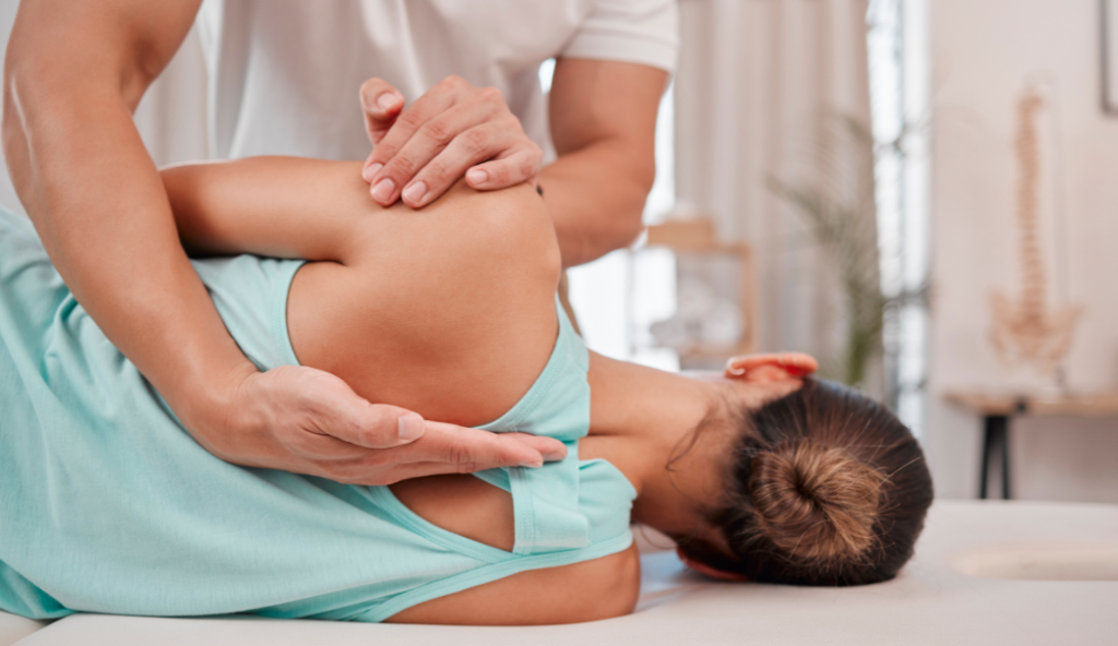 Chiropractor treating spine
