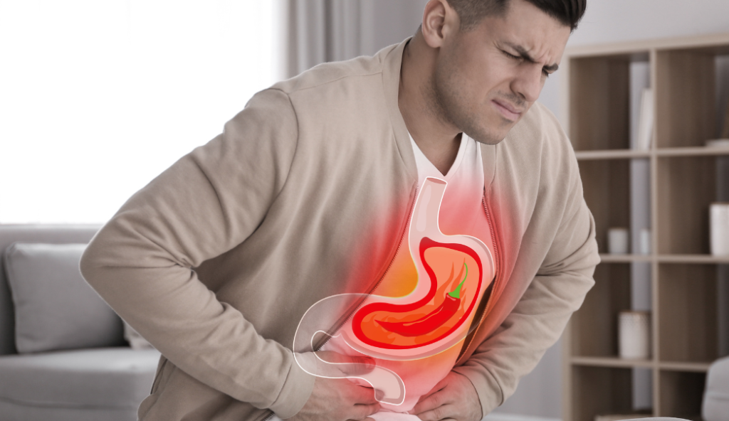 Man with indigestion after eating spicy food