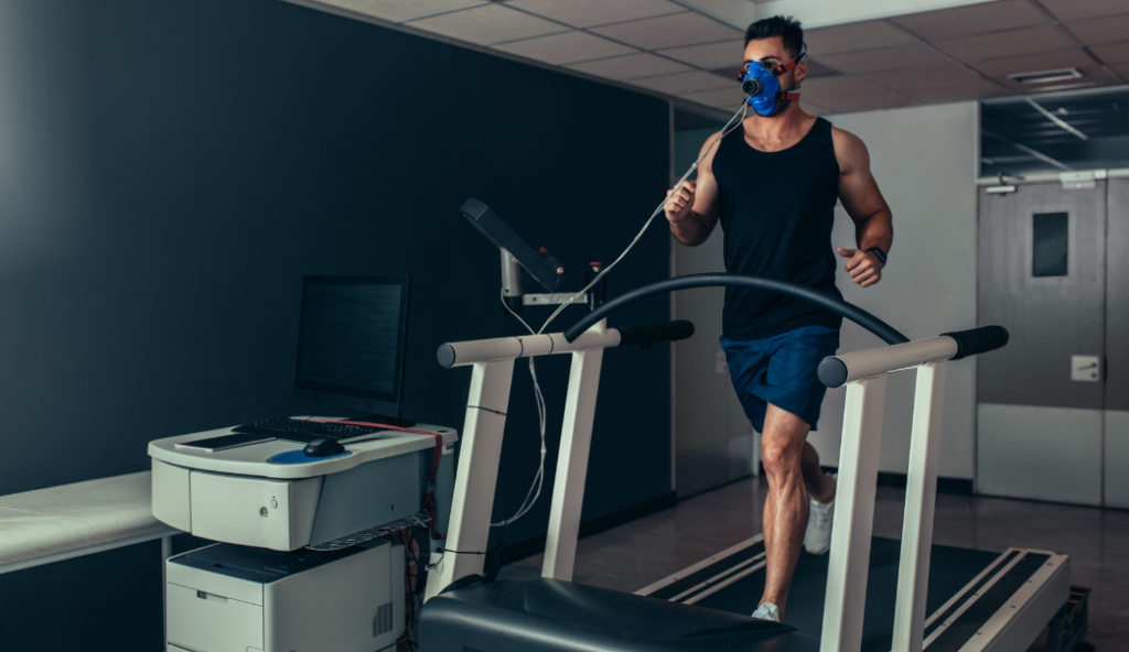 Man running on treadmill with respirator mask for biomechanics study
